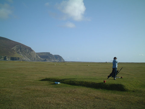 Golfer teeing off at Keel